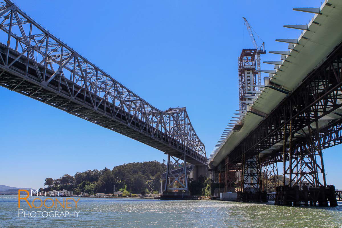 old bay bridge next to self-anchored suspension bridge construction