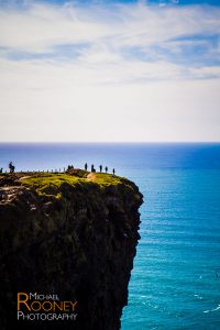 hikers cliffs of moher county clare ireland sunny