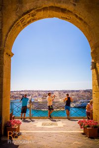 tourism valletta malta upper barrakka gardens sunny bay water historic photo