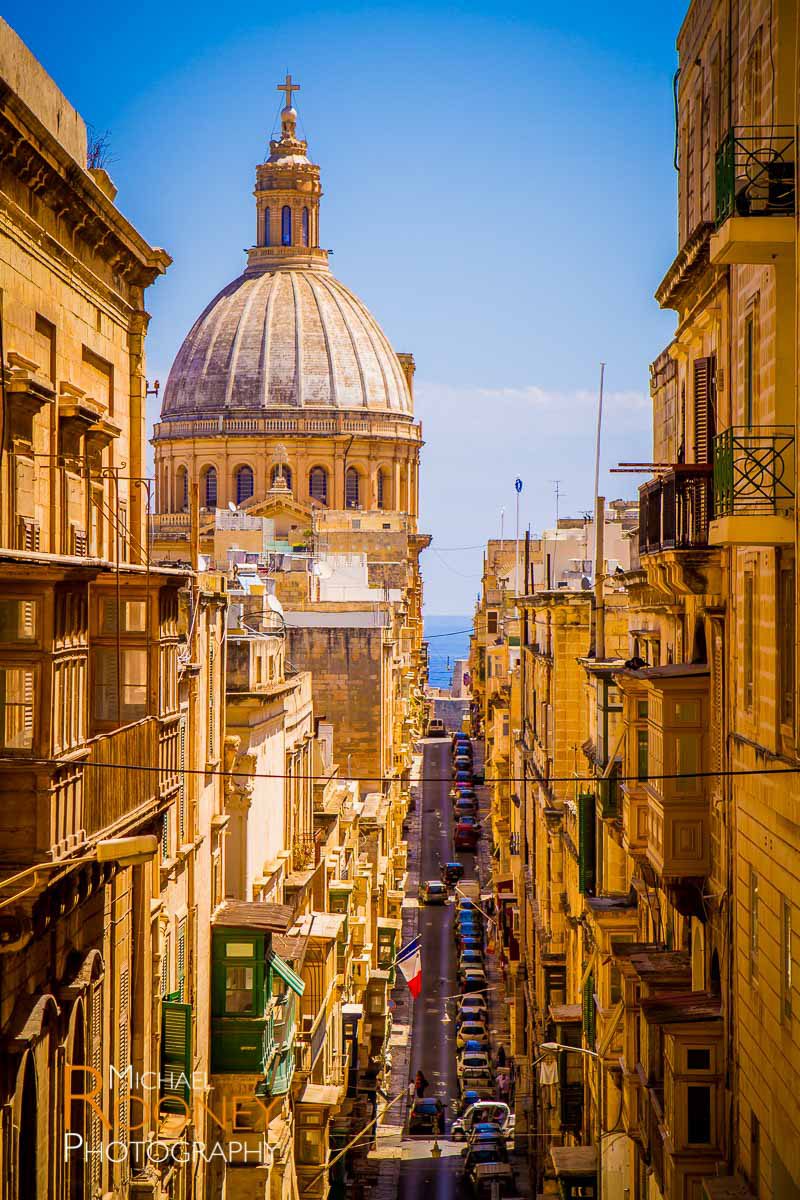 basilica church dome valletta malta mount carmel street narrow steep tourism historic urban
