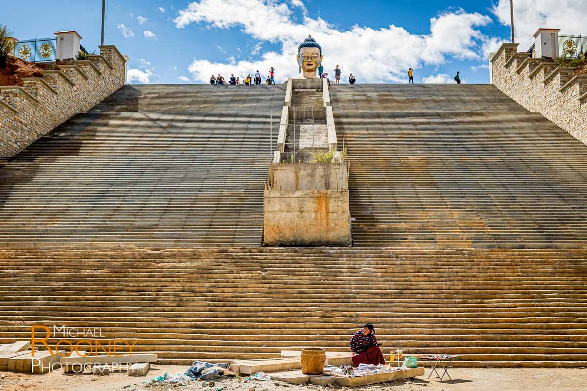 giant buddha statue thimphu stairs stairway bhutan woman buddhist