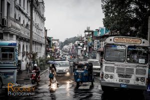 rainy downtown traffic vehicles kandy sri lanka
