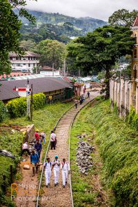 students railroad train tracks kandy sri lanka